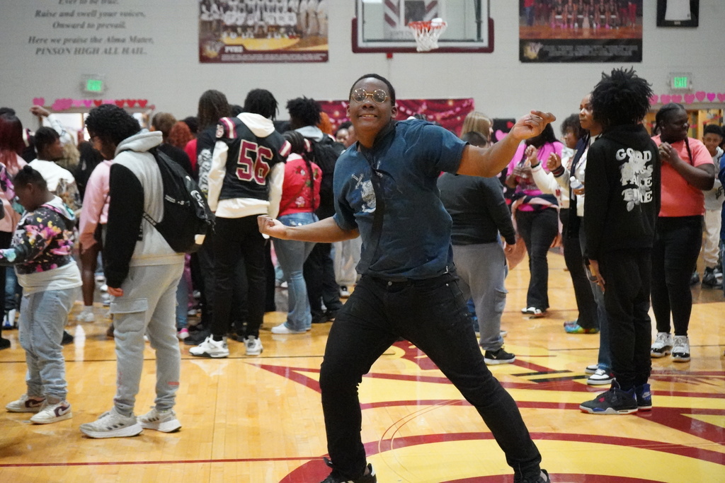 A student dances at a school dance.