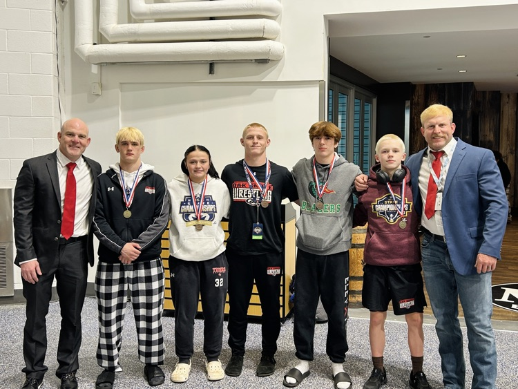 coaches and wrestlers at State championship