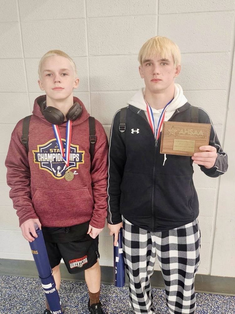 2 students with medals and award earned