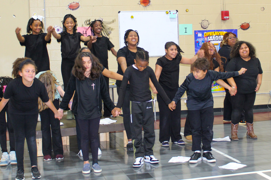 Johnson Elementary students bow after performing in the school's Black History Month play.