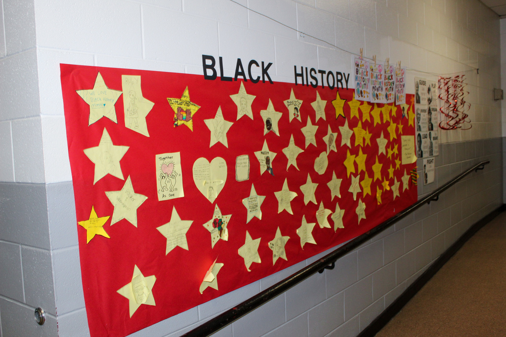 Student artwork for Black History Month lines the walls of Kermit Johnson Elementary School.