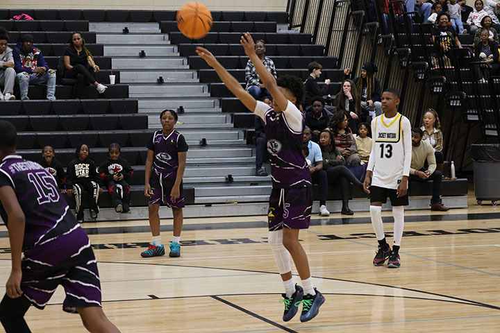 A Minor Middle School boys basketball player shoots a ball from the free throw line during a game against McAdory Middle School's boys team.