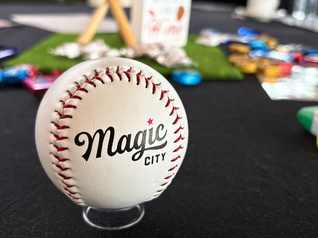 A baseball on a stand. The baseball reads "Magic City."