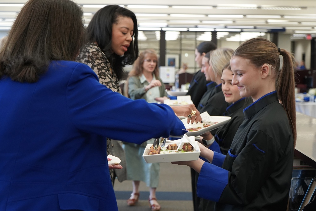 JEFCOED Culinary Arts students serve appetizers to JEFCOED employees.