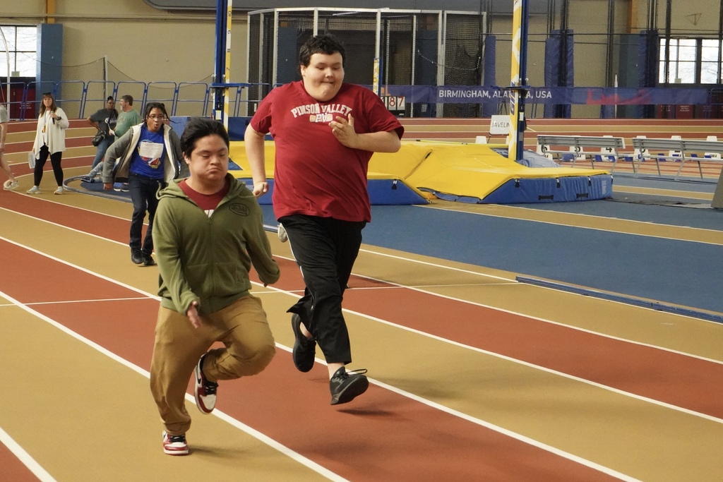 Students race down the track at the Birmingham CrossPlex.