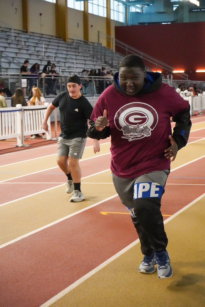Students race down the track at the Birmingham CrossPlex.