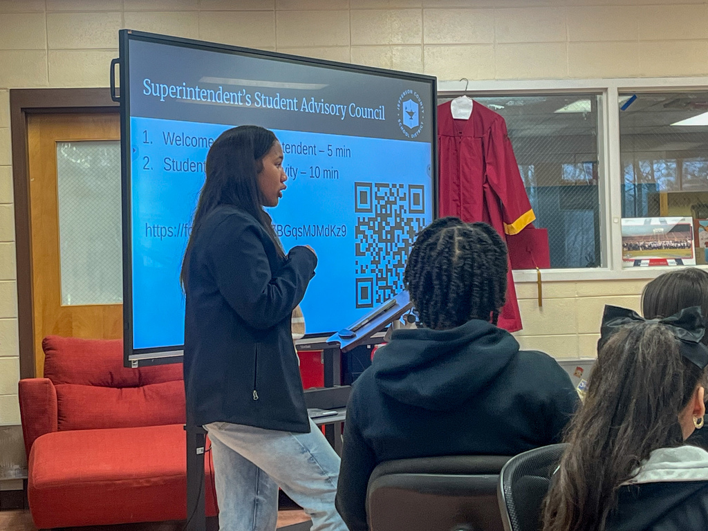 A student addresses fellow students from the front of a room during the JEFCOED Superintendent's Student Advisory Council meeting.