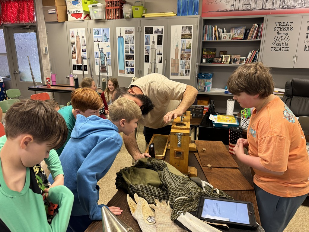 4th grade RLC students are getting an up close look at an observation hive with a visiting beekeeper.