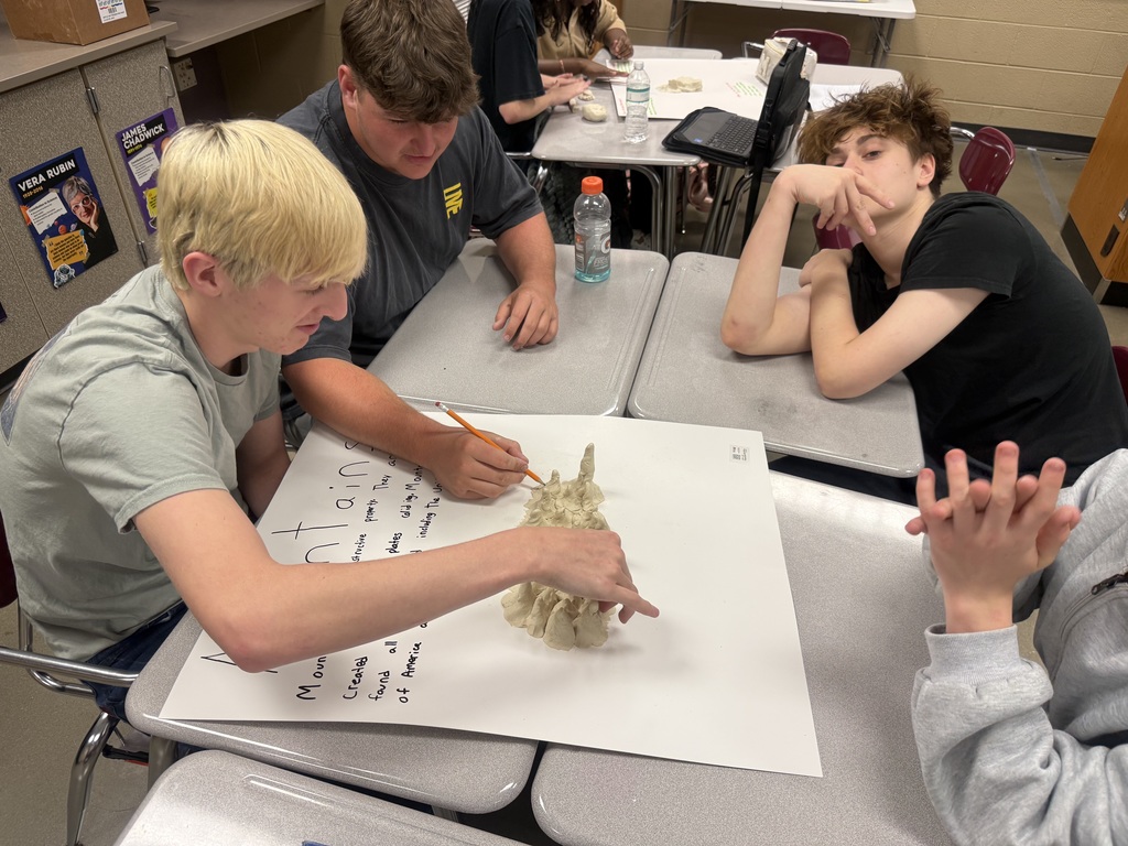 Coach Hall's Class making land formations using clay pic 3