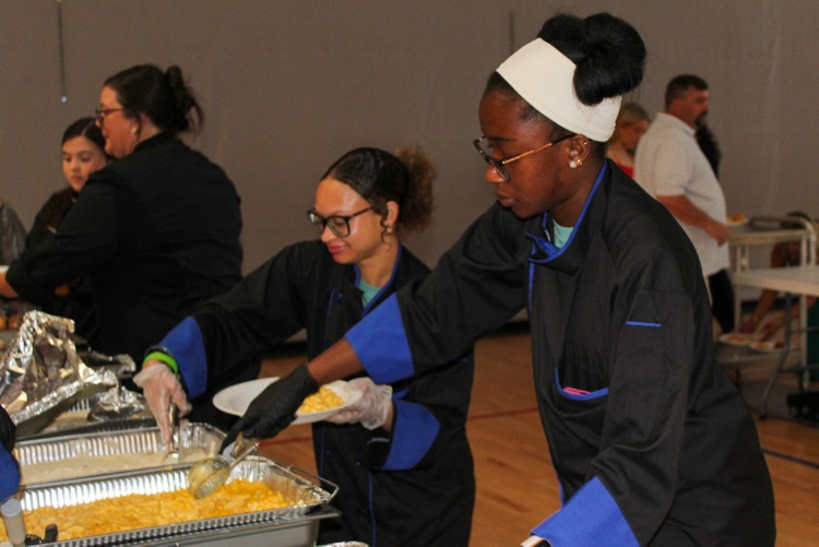 Culinary students serve food at JEFCOED’s Exceptional Prom.