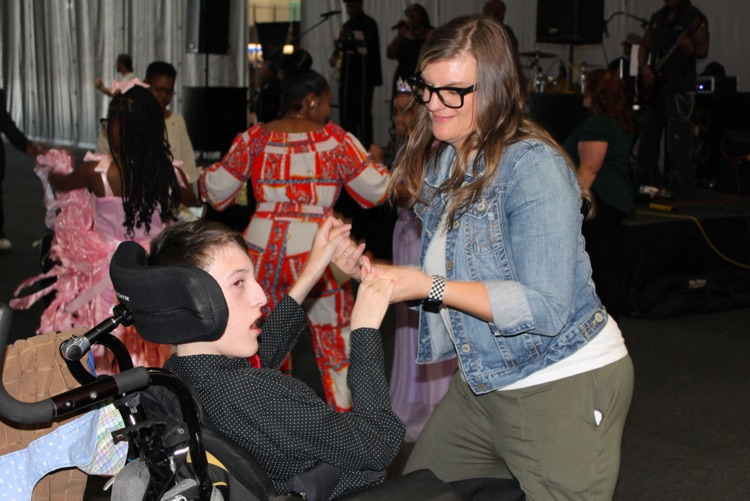 A woman dances with a student at JEFCOED’s Exceptional Prom  