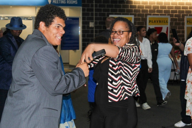 A student and a woman dance and smile at JEFCOED’s Exceptional Prom  