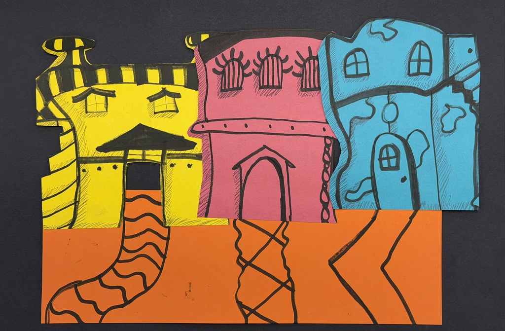 yellow, red, and blue Dr. Seuss-style houses on orange street