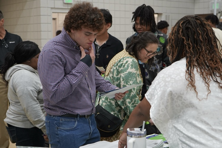 A student listens to a representative of a company during the JEFCOED Industry Connection Day  