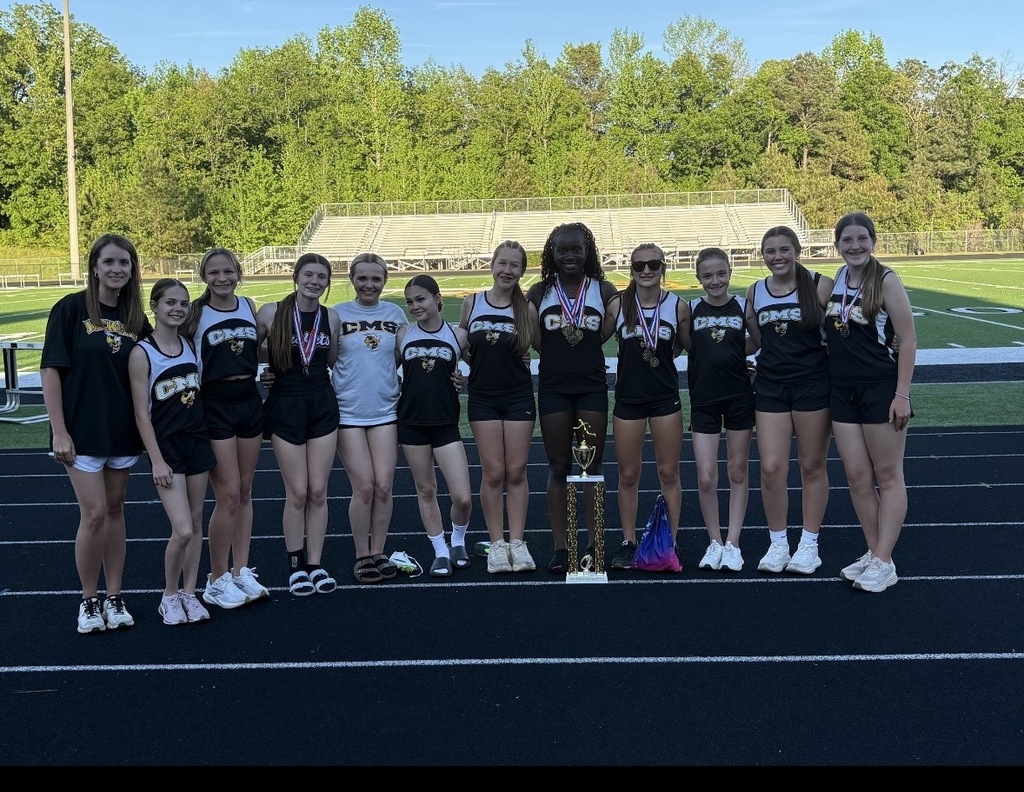 Corner Middle School's girls track team members pose with their 1st place trophy from the JEFCOED Track and Field Championship.
