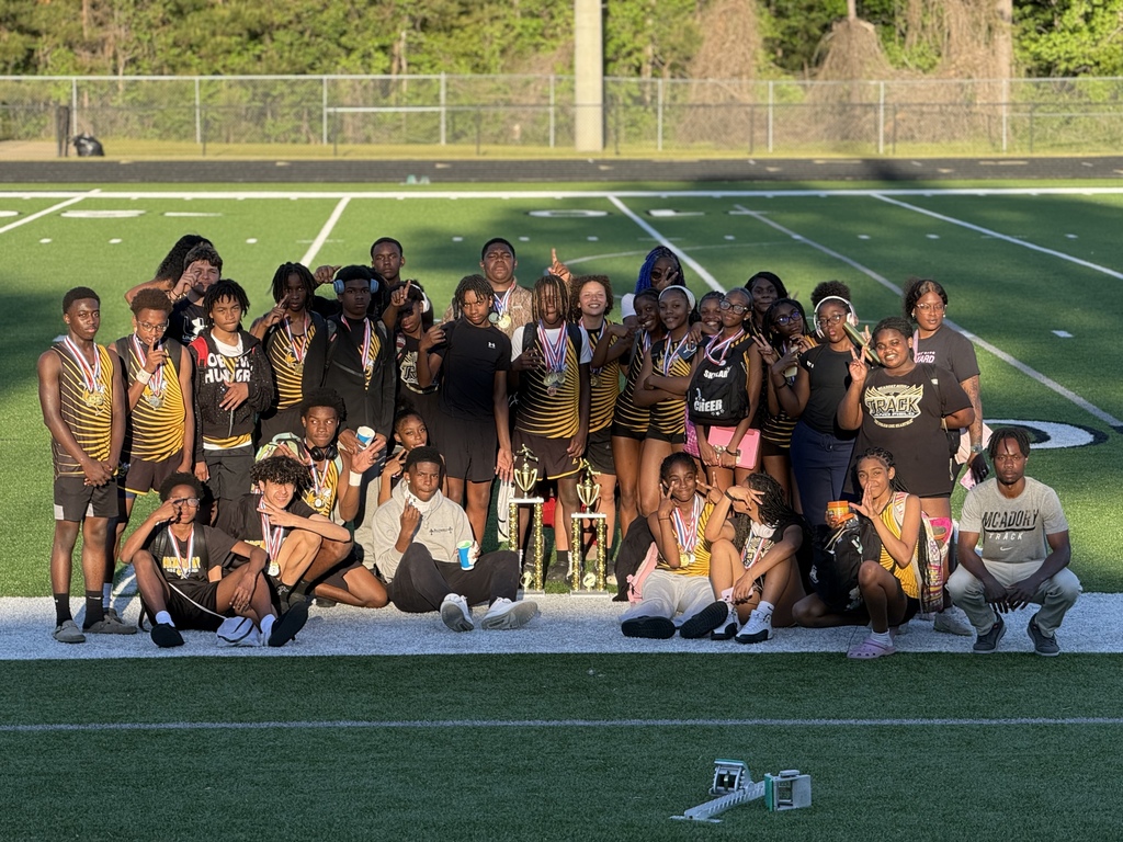 McAdory Middle School track and field members pose for a photo with a first and second place trophy from the JEFCOED Track and Field Championship.