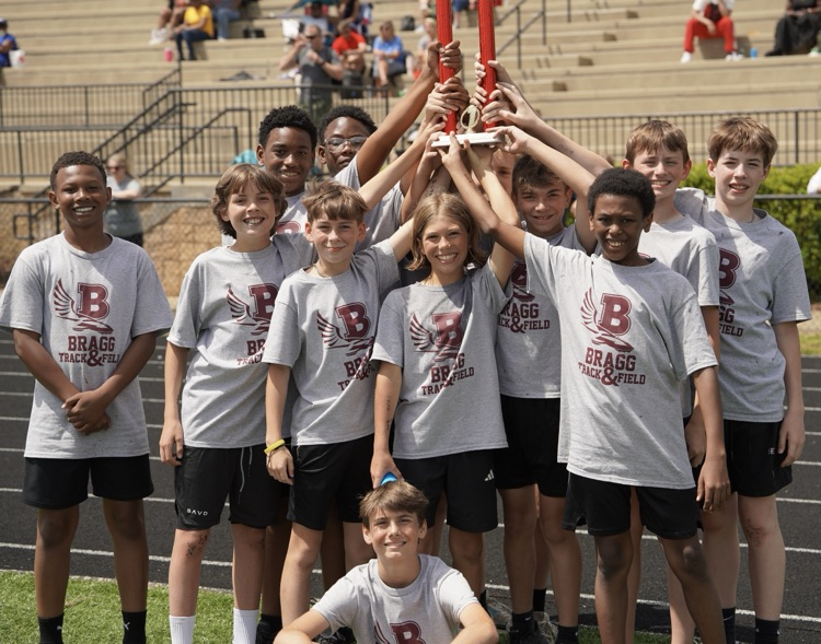 Bragg Middle School’s 6th grade boys pose for a photo with a trophy.