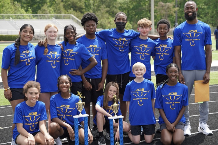 JCIB’s track team poses for a photo with their trophies after the JEFCOED 6th Grade Track and Field Championship.