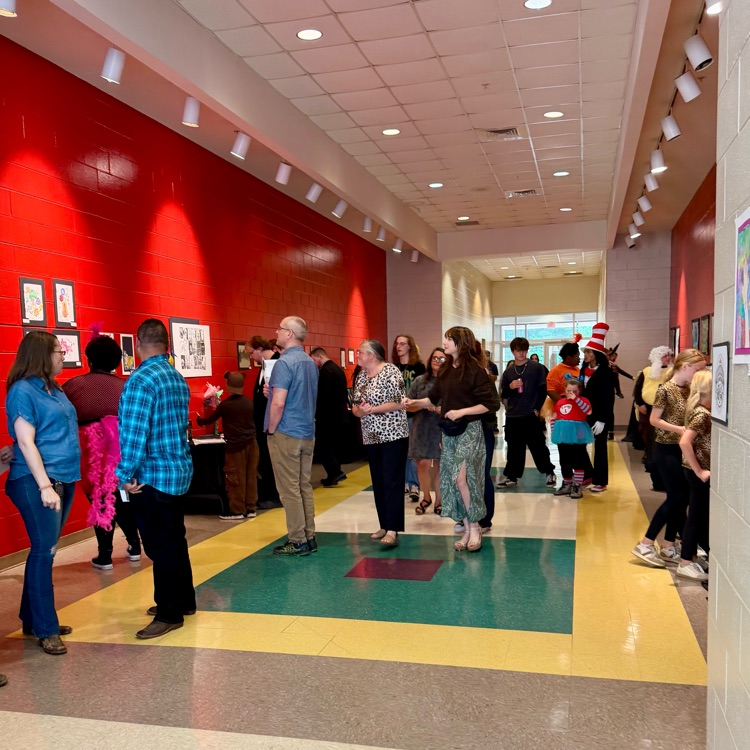people viewing artwork