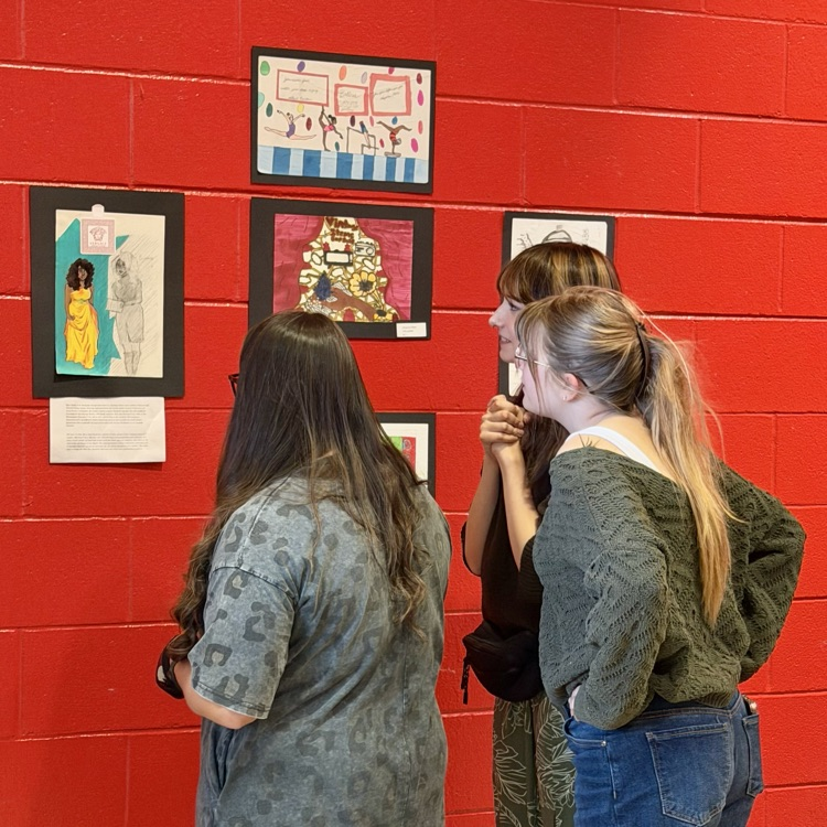 people viewing artwork