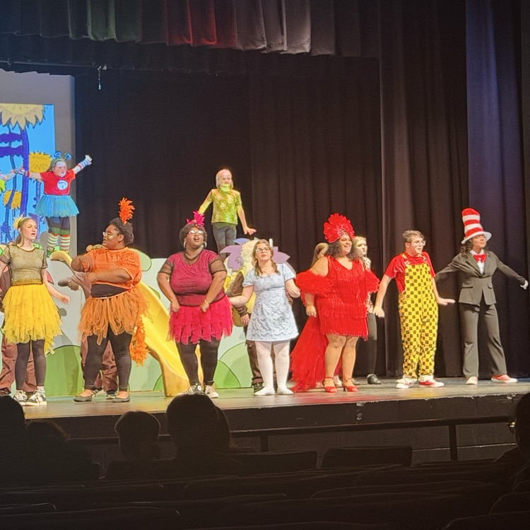 theater students on stage in costume