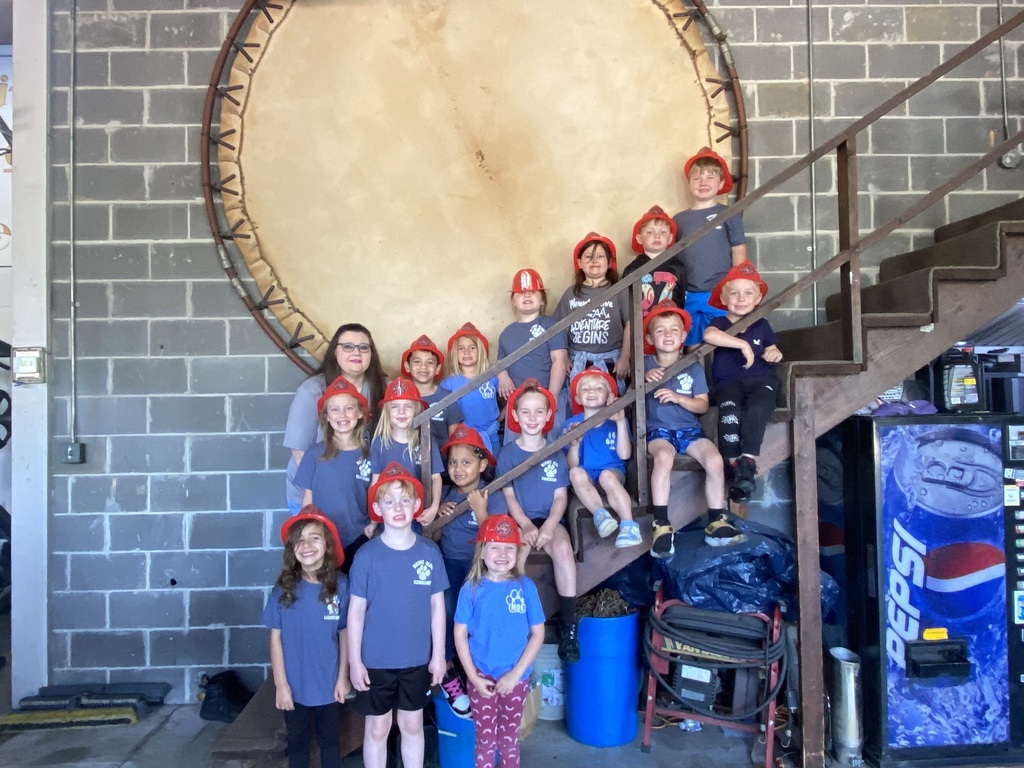 kindergarten students posing on a field trip throughout the city