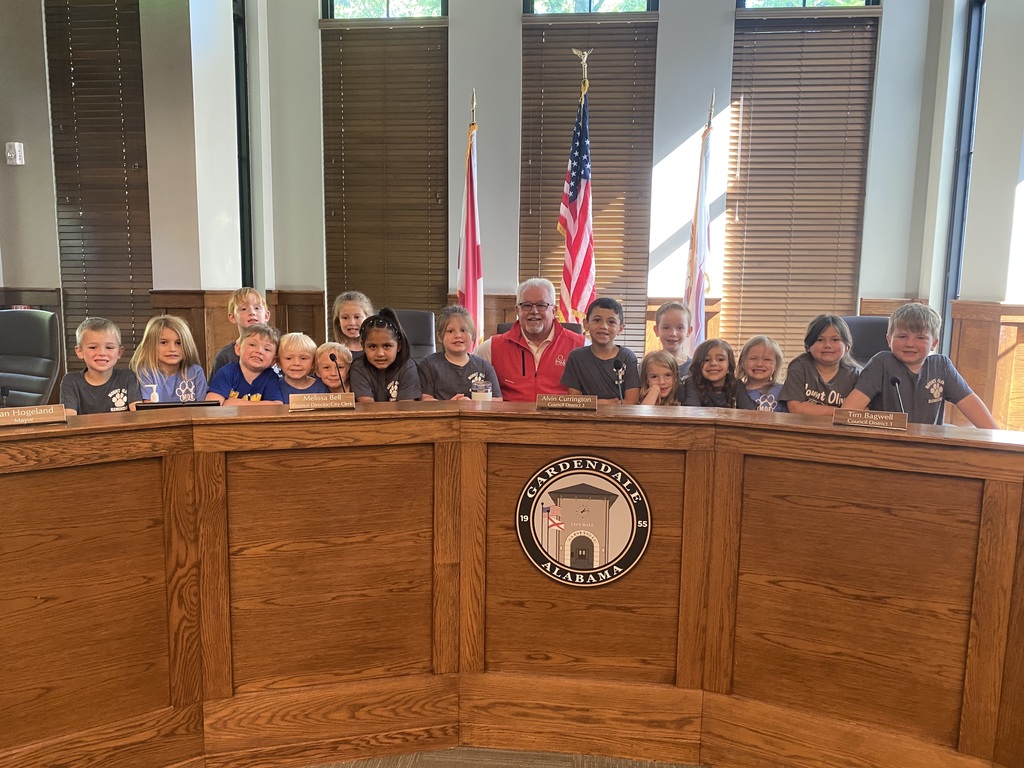 kindergarten students posing on a field trip throughout the city