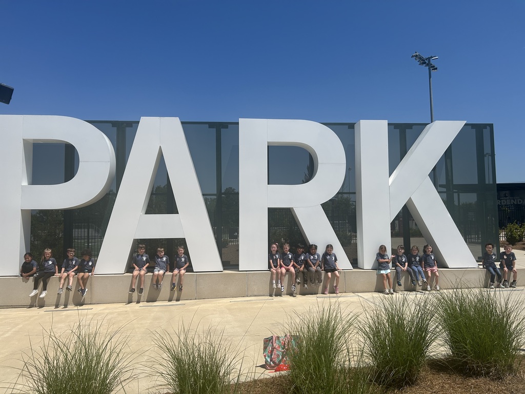 kindergarten students posing on a field trip throughout the city