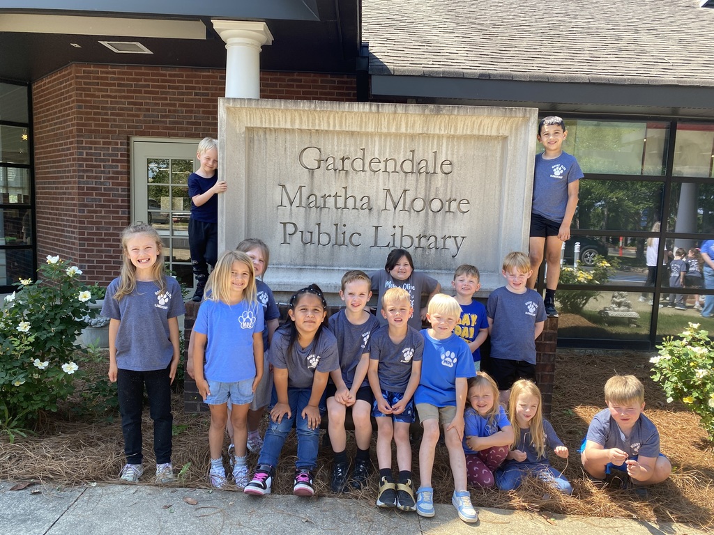 kindergarten students posing on a field trip throughout the city