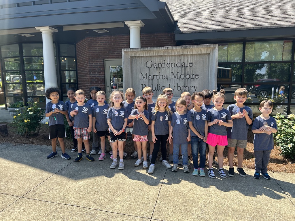 kindergarten students posing on a field trip throughout the city