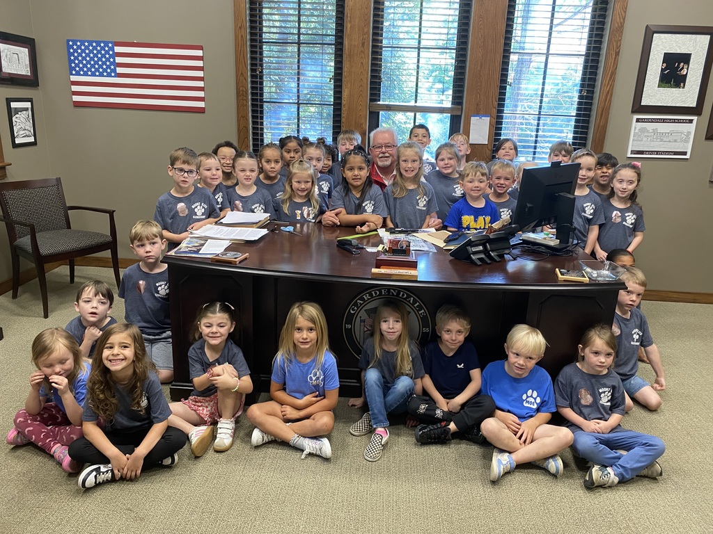 kindergarten students posing on a field trip throughout the city