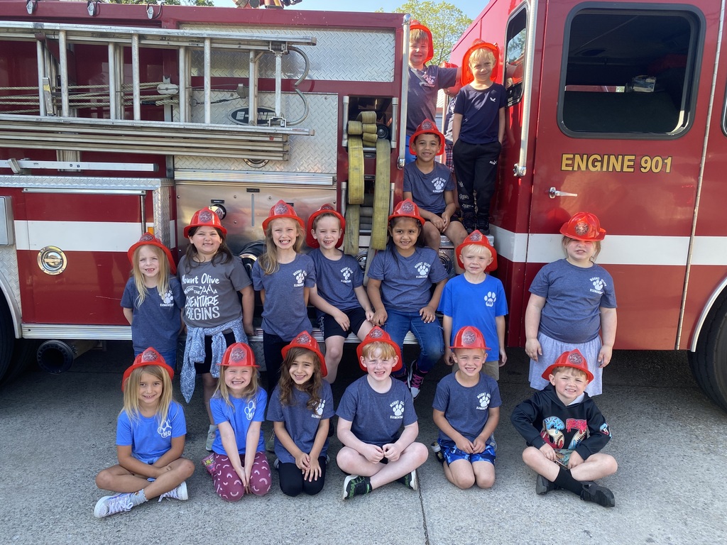 kindergarten students posing on a field trip throughout the city