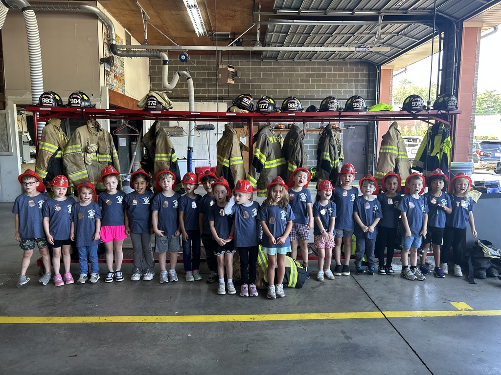 kindergarten students posing on a field trip throughout the city