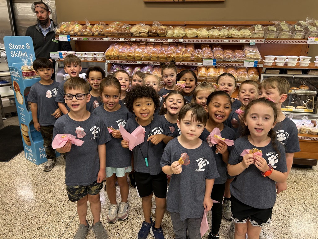 kindergarten students posing on a field trip throughout the city