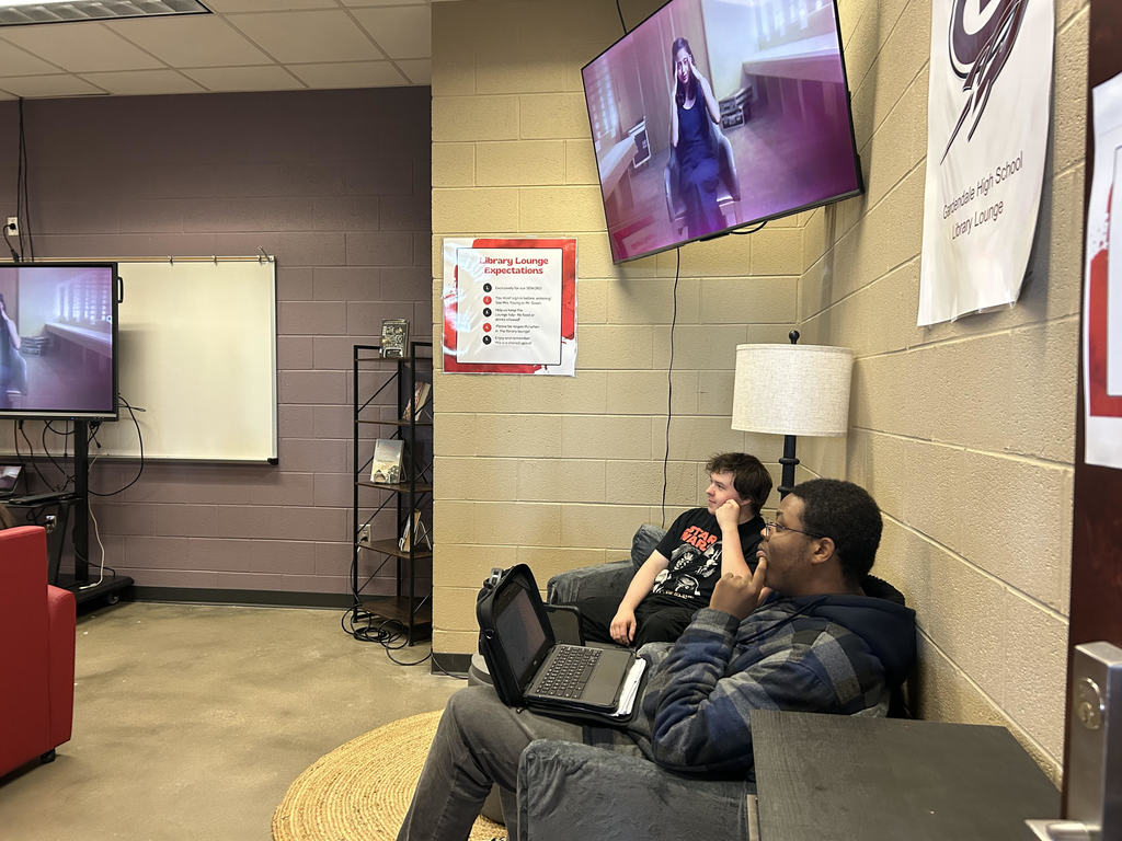Student Lounge 2 students sitting and watching tv