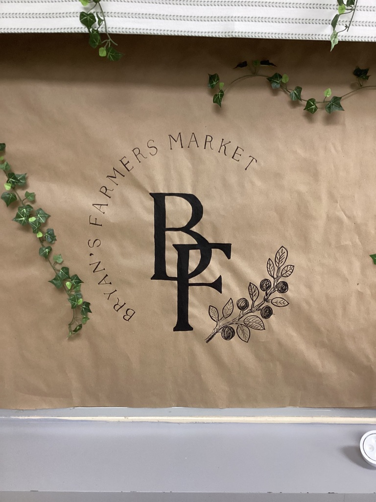 The letters B and F are joined together on a brown background. Ivy decorates the Bryan's Farmers Market sign.