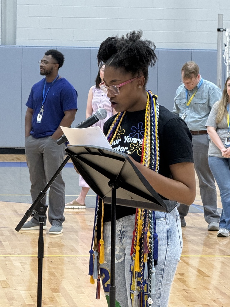 a student reads a speech as part of the ceremony