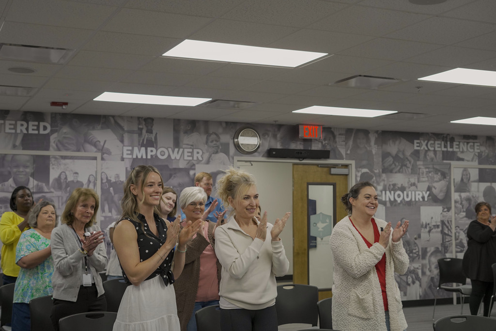 JEFCOED Ex-Ed employees stand and clap during the JEFCOED Strong Award presentation in the Jefferson County Schools board room.