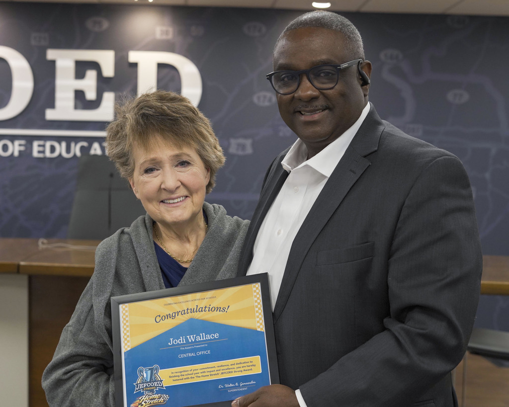 Jodi Wallace and Superintendent Dr. Walter Gonsoulin smile for a photo inside the JEFCOED board room.