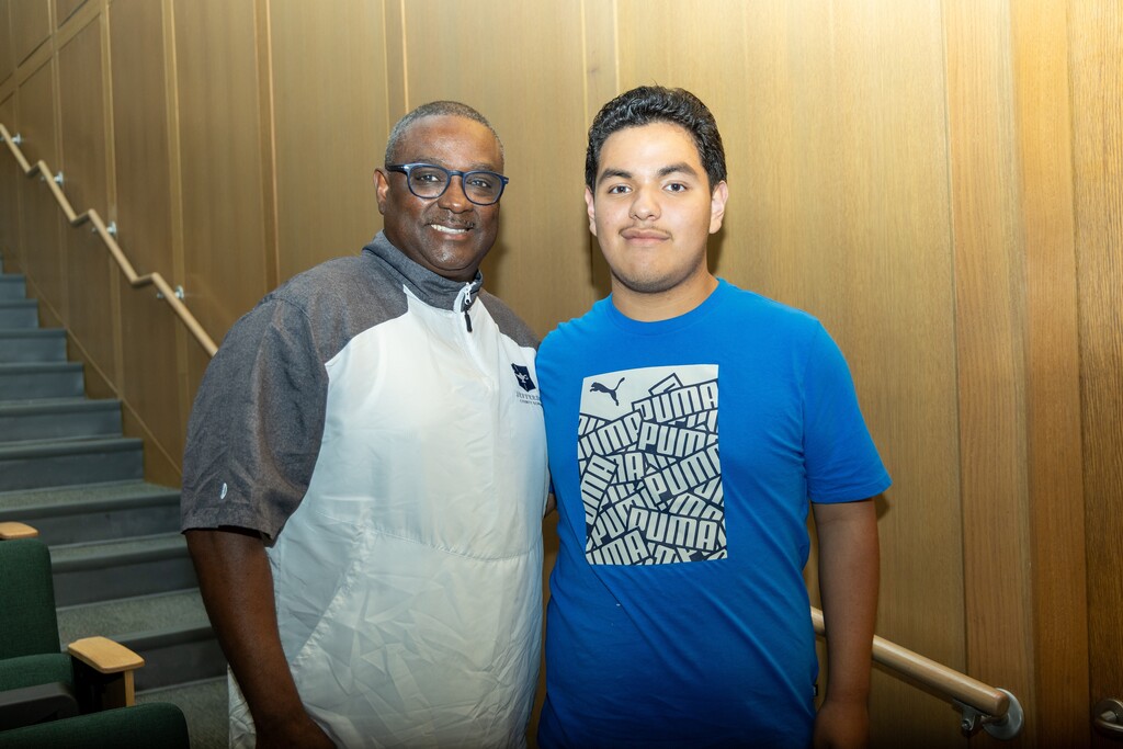 Superintendent Dr. Walter Gonsoulin poses for a photo with a student.