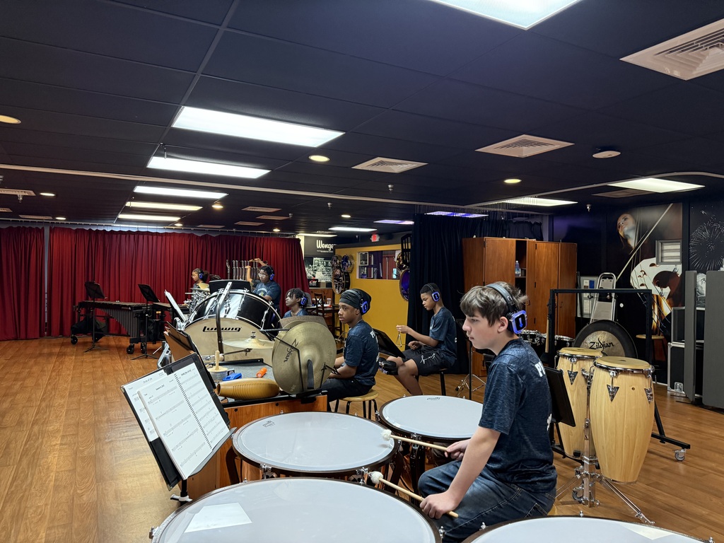 Clay-Chalkville Middle School band students play instruments inside a room.