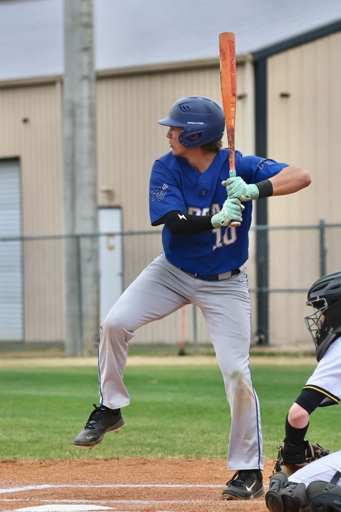 John Owen Dean, Mortimer Jordan baseball player swings a bat during a baseball game.