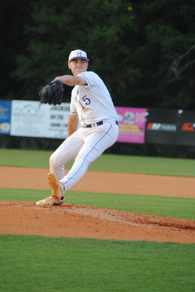 Hueytown High School baseball player Will Vaughan pitches a ball during a baseball game.