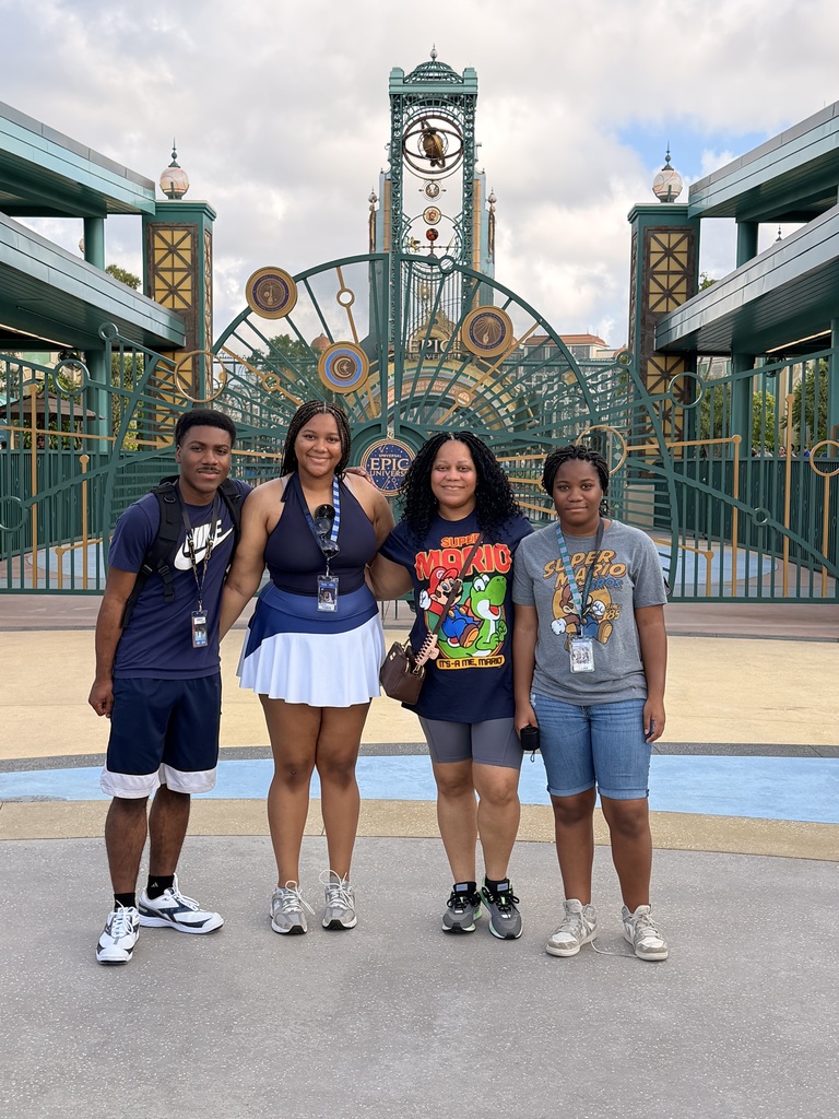 A family poses together for a photo at Universal Studios.