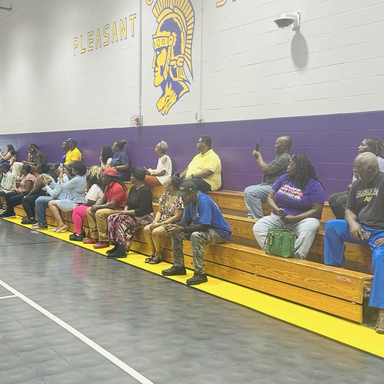 Parents sitting in the stands watching students earn awards at the SOAR program.