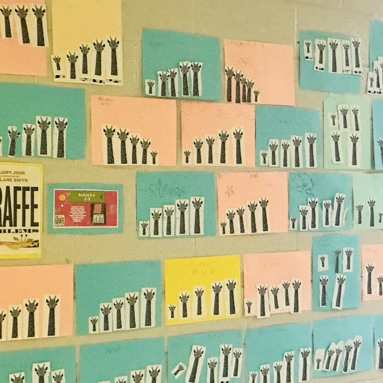 Students work from the SOAR program placed on the wall.
