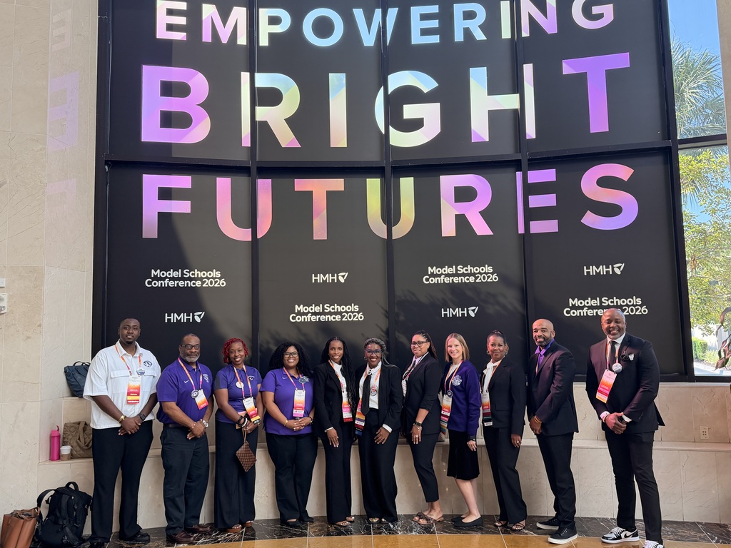 Educators and administrators from Minor High School pose together for a photo at the Model Schools Conference.