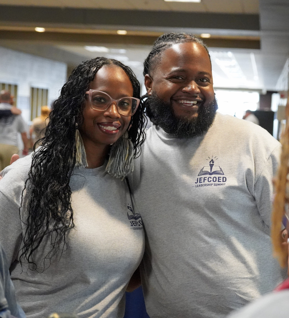 Two attendees of the JEFCOED Leadership Summit smile for a photo. 