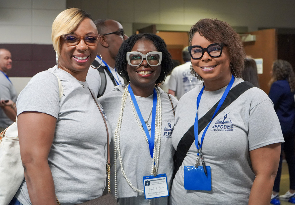 Attendees of the 2026 Leadership Summit smile at the camera. 