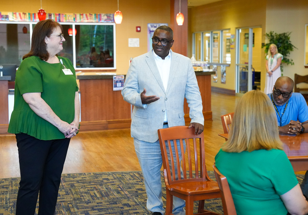 JEFCOED Superintendent Dr. Walter Gonsoulin speaks to a room of people inside a library.